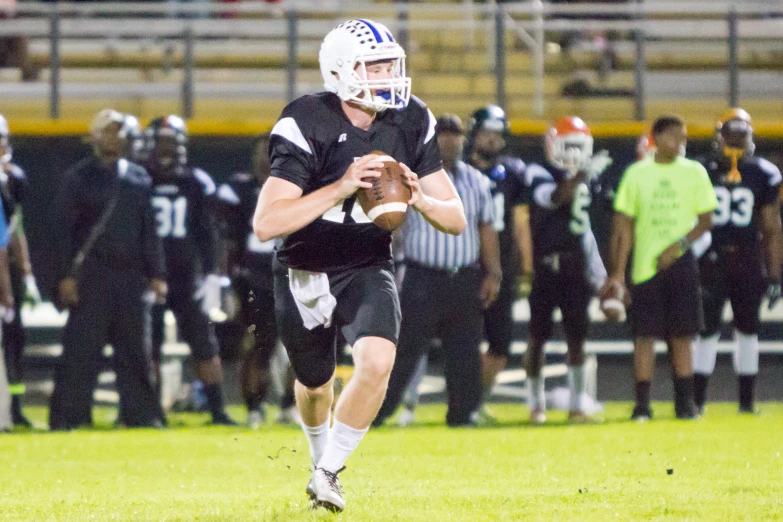 a football player running with the ball