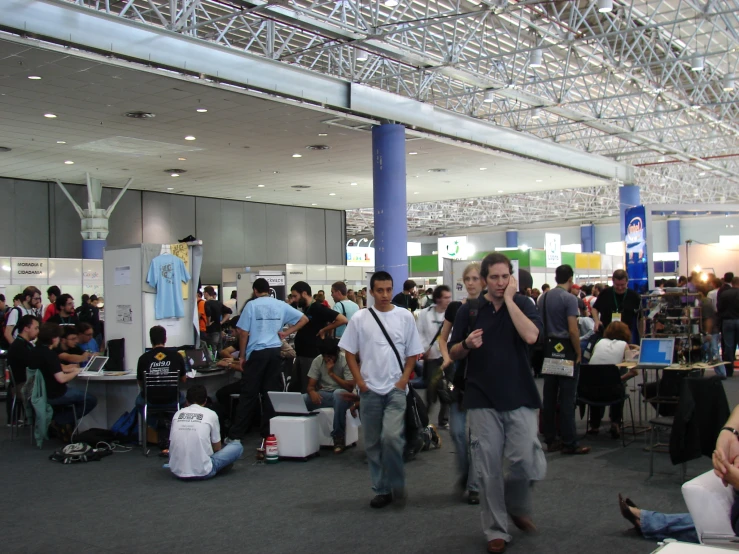 people are in an airport with luggage and checkers