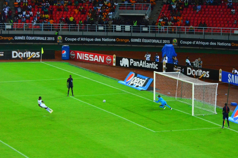 several soccer players in action on the field