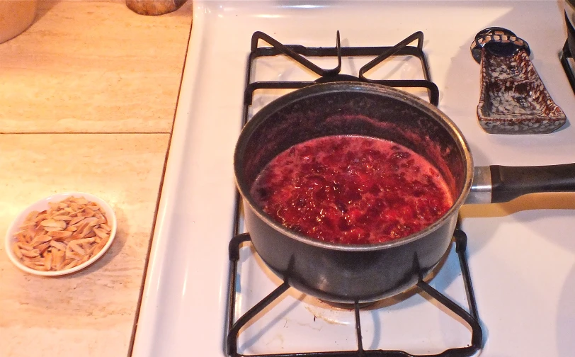 a pot of food is on a stove top