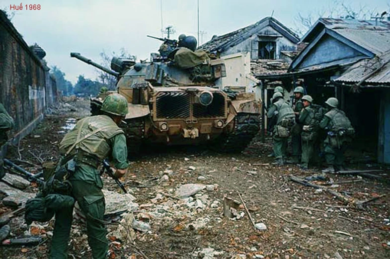 men standing around with tanks in front of them