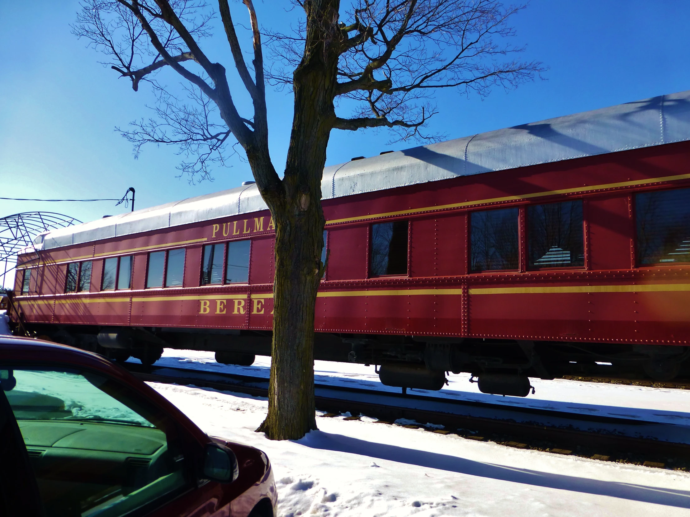 an old train on the tracks, in winter