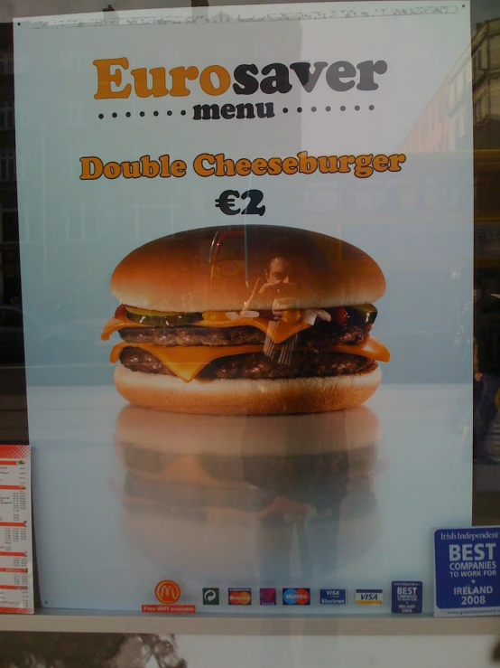 a sandwich ad for a restaurant on the front of a window