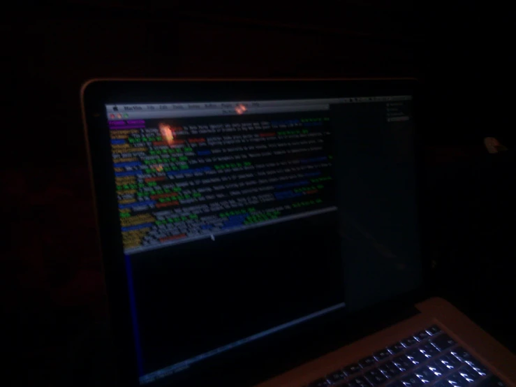 the dark side of a mac laptop, displaying several programs