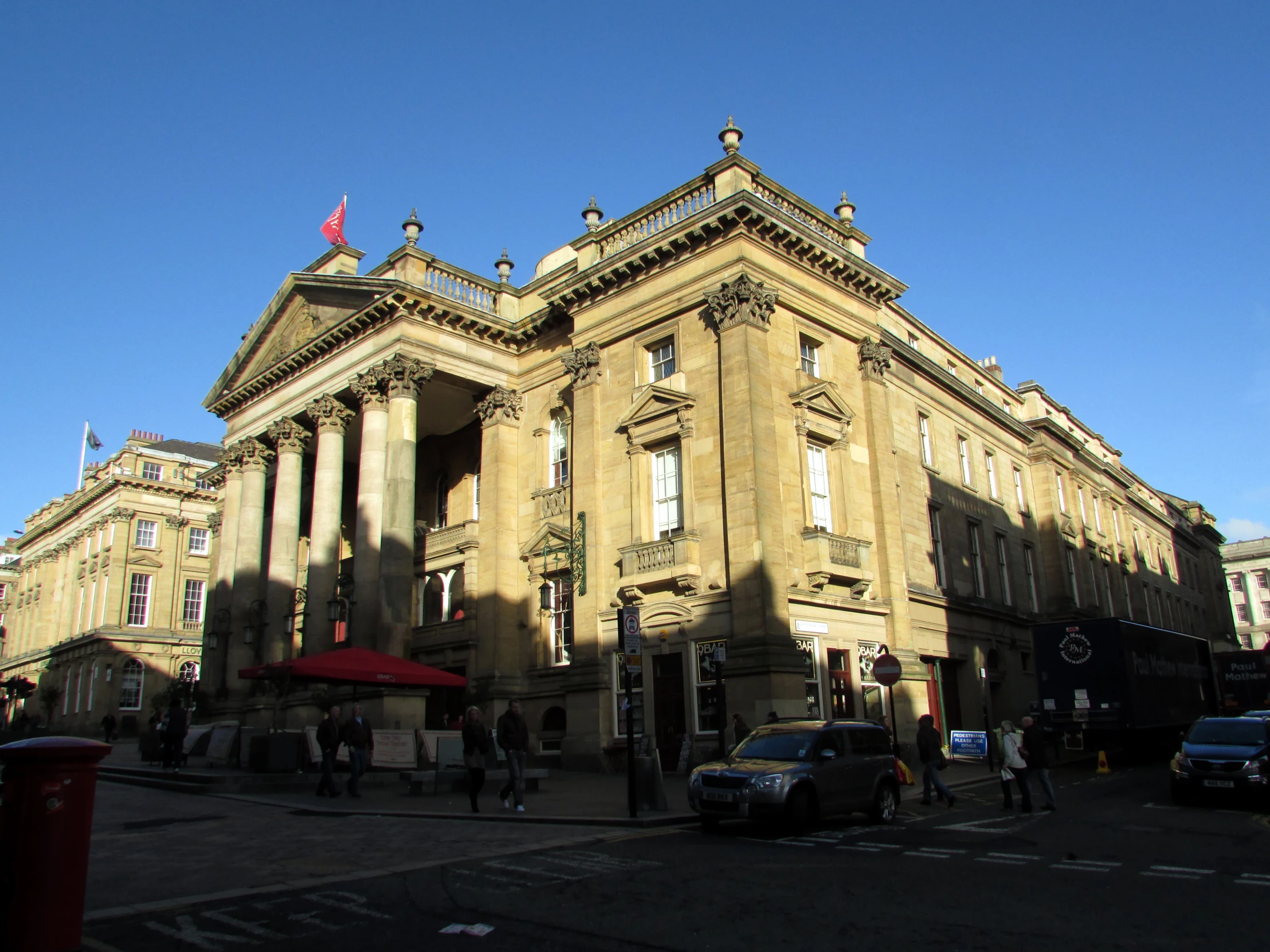 the building is brown and has an entrance