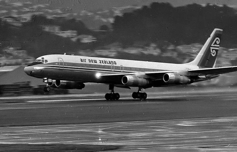 an old airplane taking off on a runway