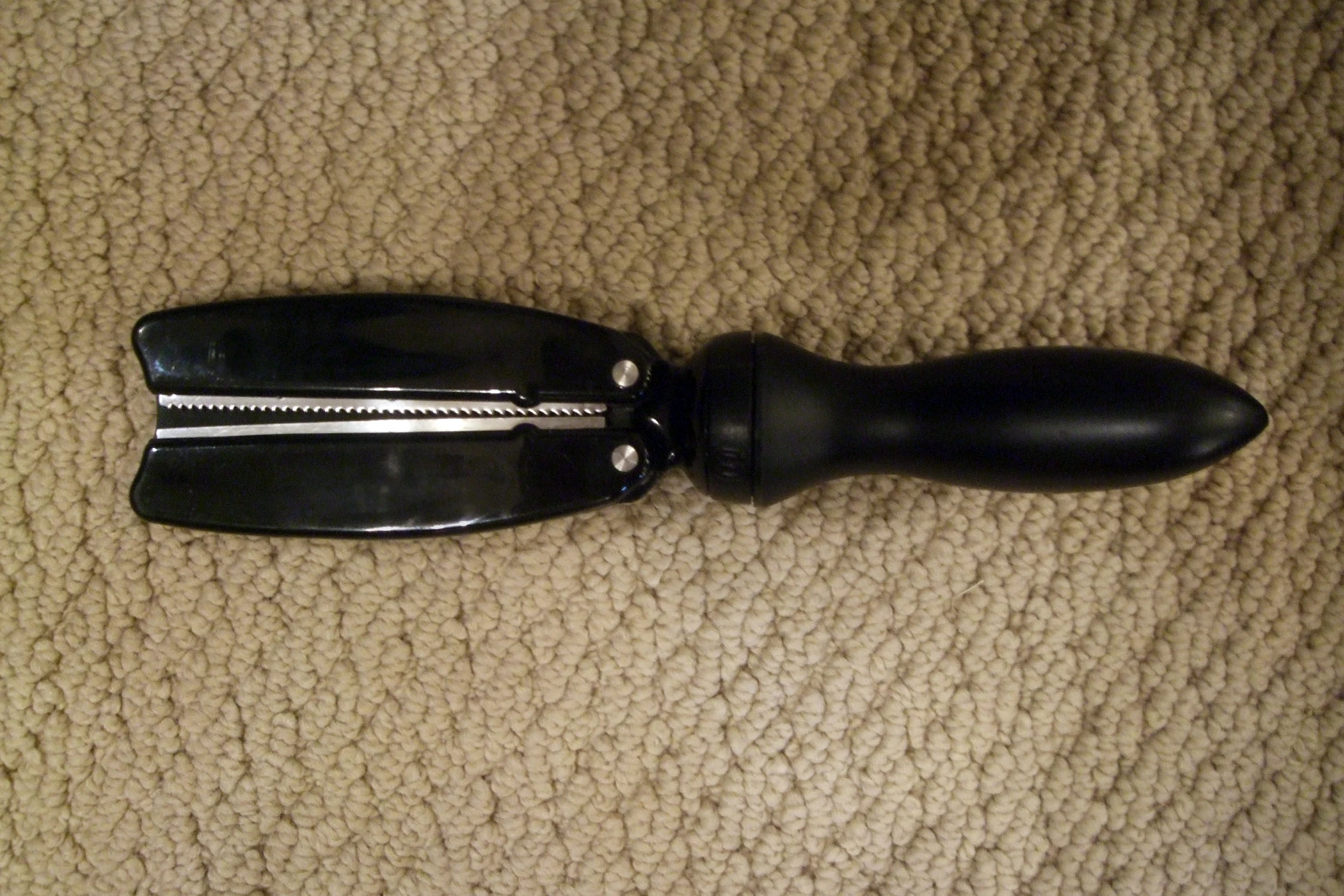 the view from above of an open black hairbrush