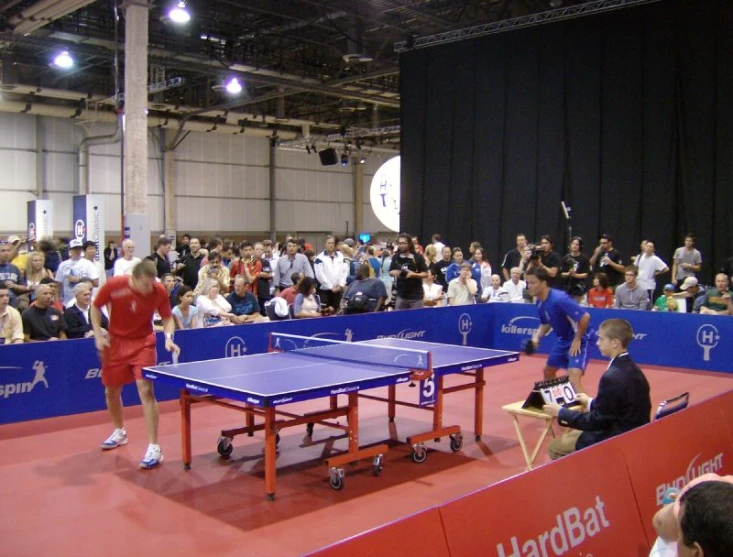 a large room with many spectators is shown