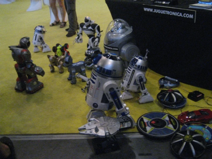 a robot toy surrounded by other toy figures