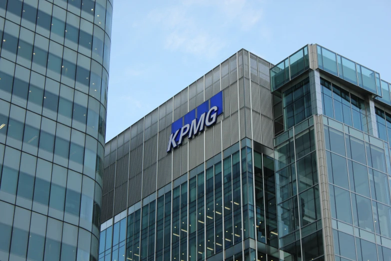 a sign is on the top of a large building