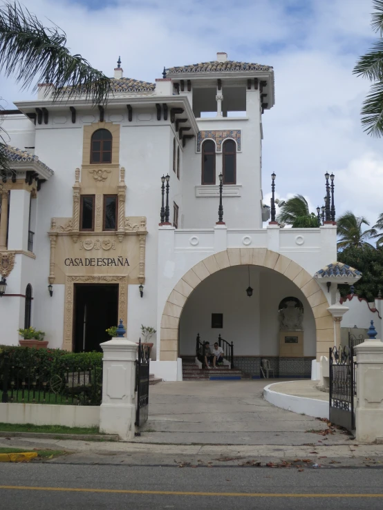 an archway has been built to allow access to the main building