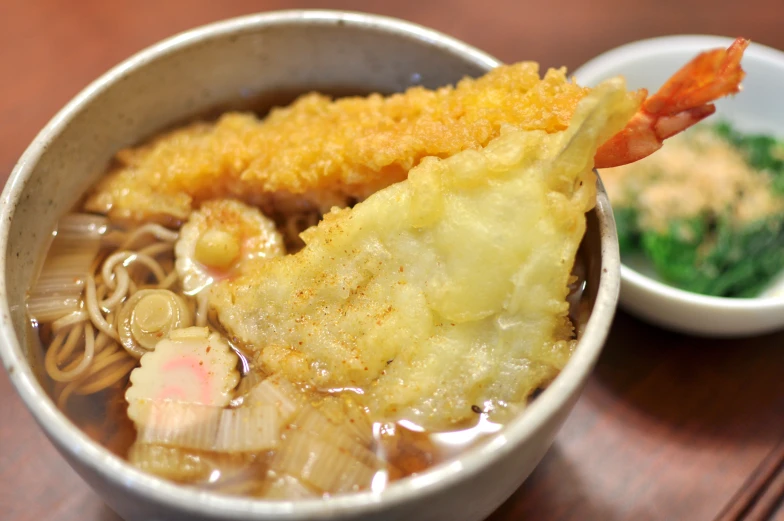 a bowl with a small dish and a few other dishes in it