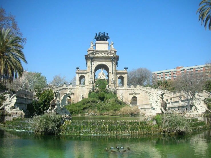 a building with a bridge over it on a clear day