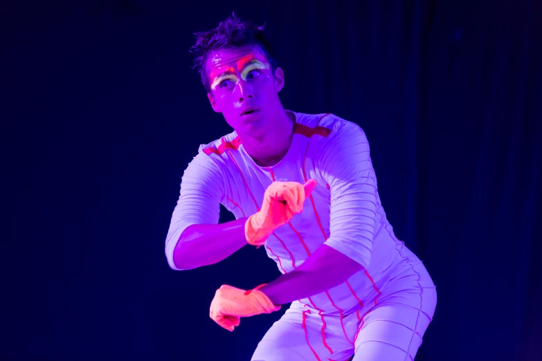 a man is dressed in bright neon and running