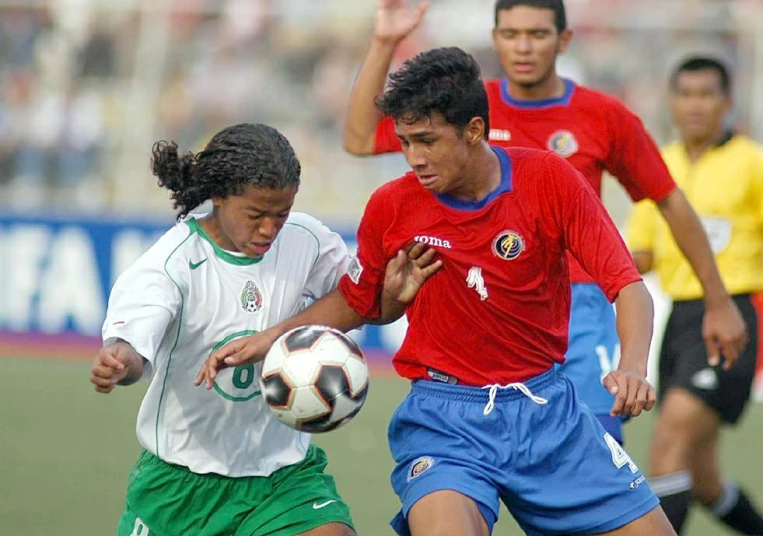 a boy gets ready to get on his soccer ball as he tries to clear the field