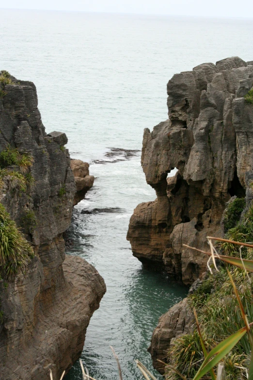 a view from an overcast rocky cliff