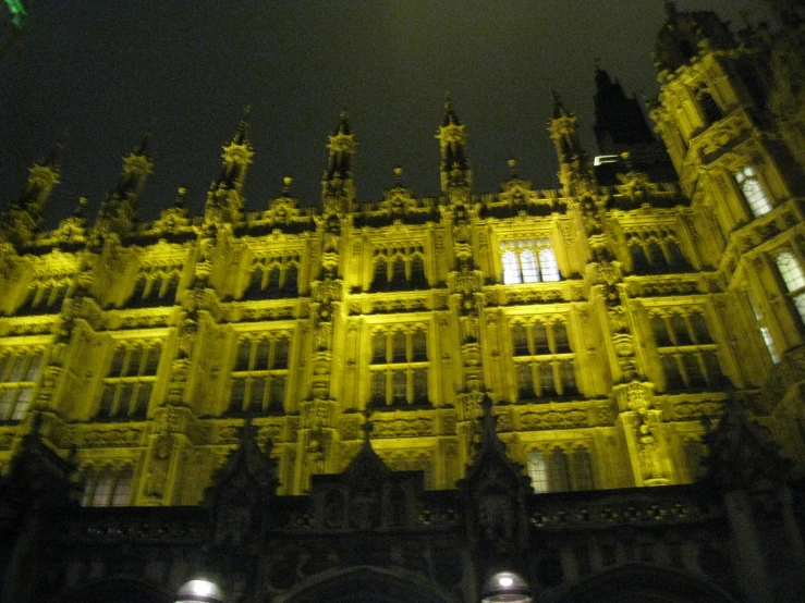 ornate architectural structure at night in dark city setting