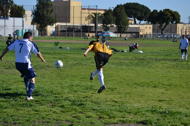 a group of young men playing a game of soccer