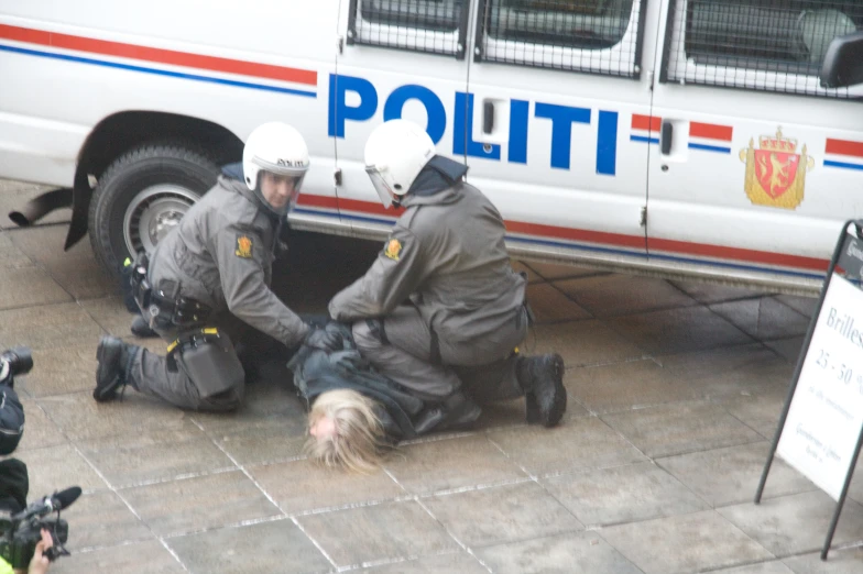 the policemen are putting on their new uniforms