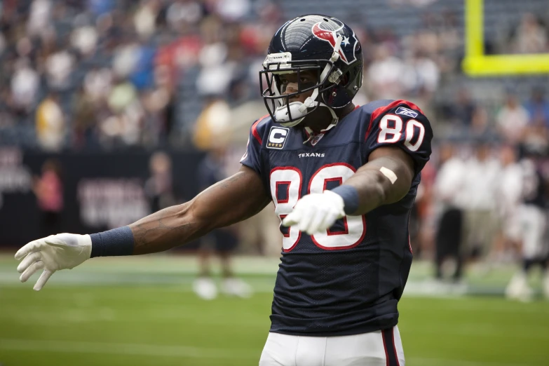 a football player running onto the field during a game