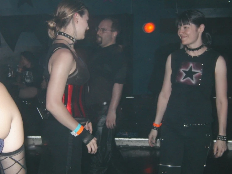 two girls in punk clothes standing next to each other
