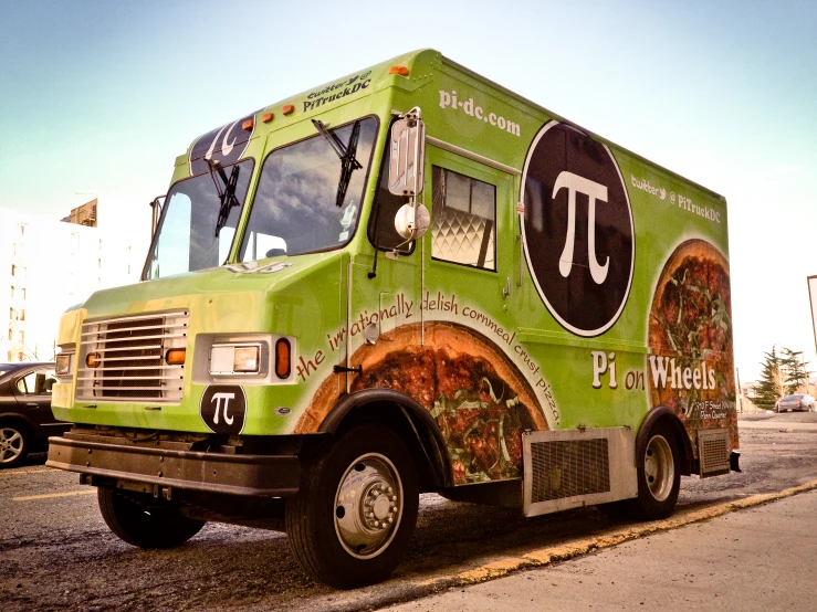 a bright green food truck has decorative lettering