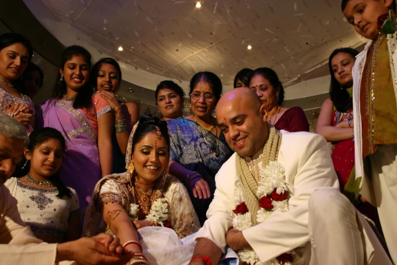 man with a wedding party holding soing in hand