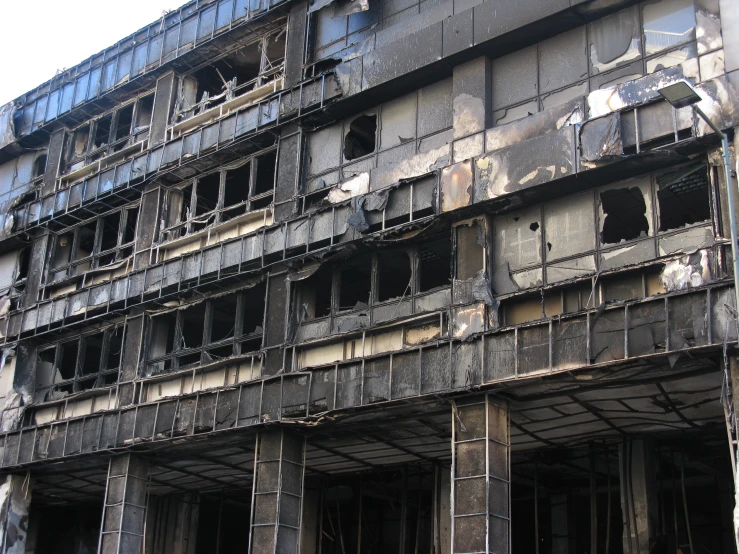 a po of an abandoned building with a lot of windows