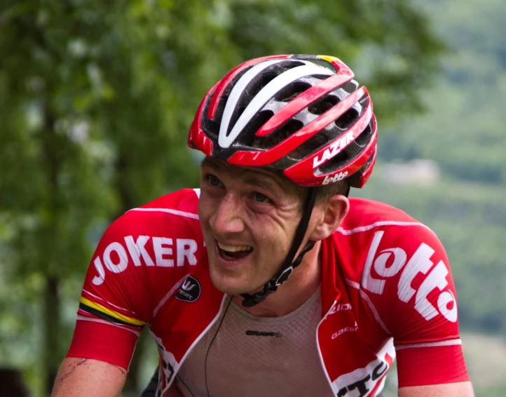 a professional cyclist is laughing for the camera