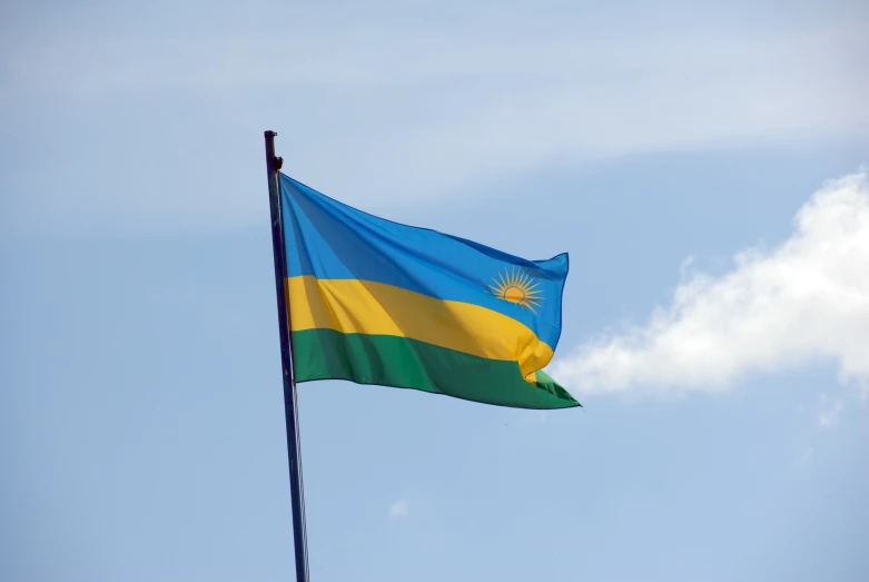 a blue and yellow flag flying in the air