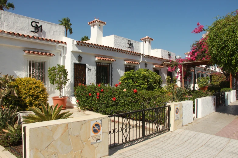 a home that has a large gate out front of it