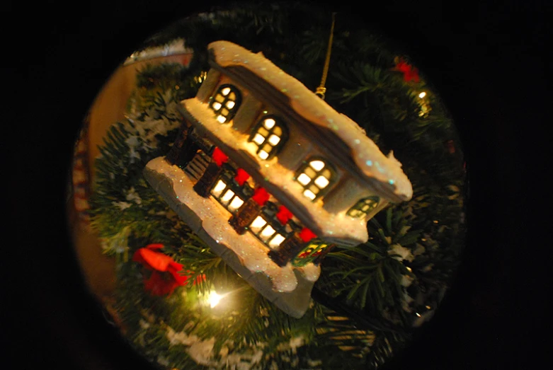 a house decorated for christmas on display with lights