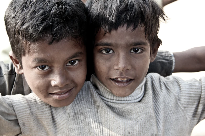 two children are standing near each other