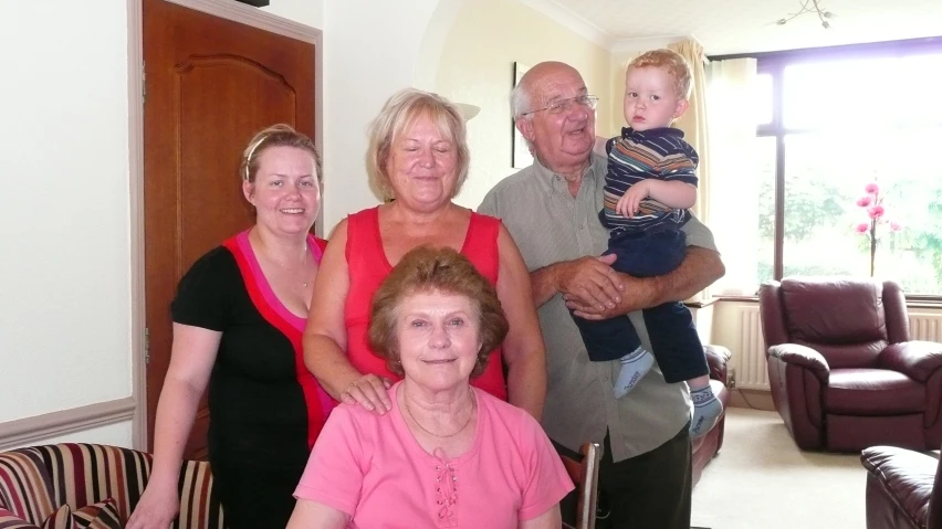 a family poses in their living room for a po