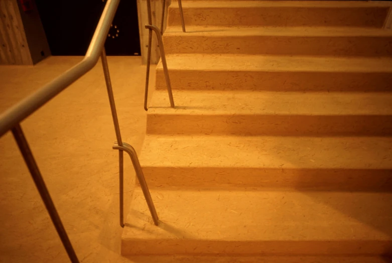 some stairs next to the door with light shining on them