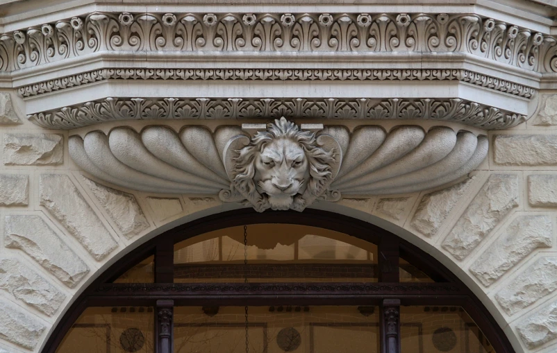 an image of a lion head decoration above a door