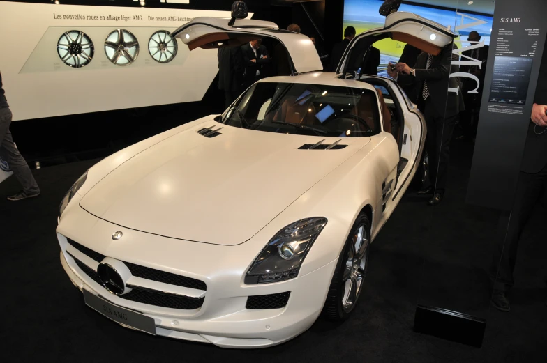 a mercedes sls coupe parked in a show room