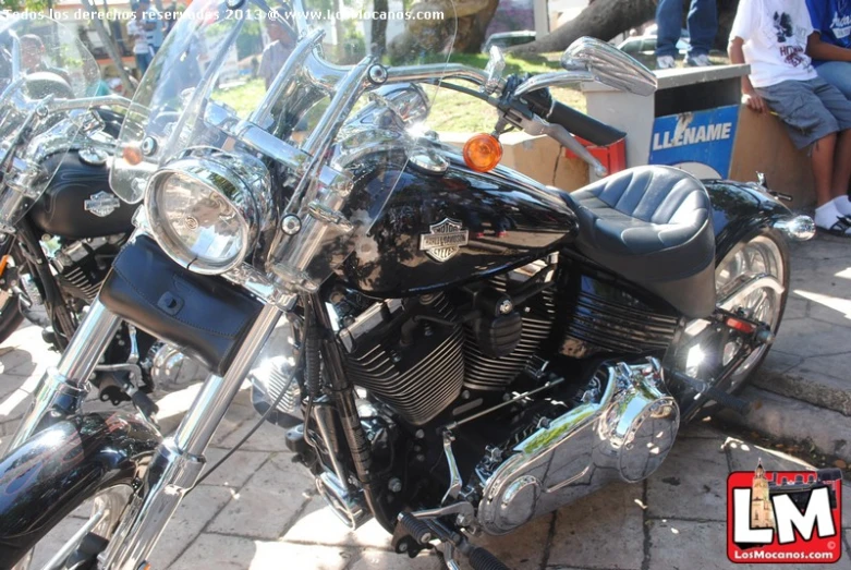 a couple of motorcycles are parked near a curb