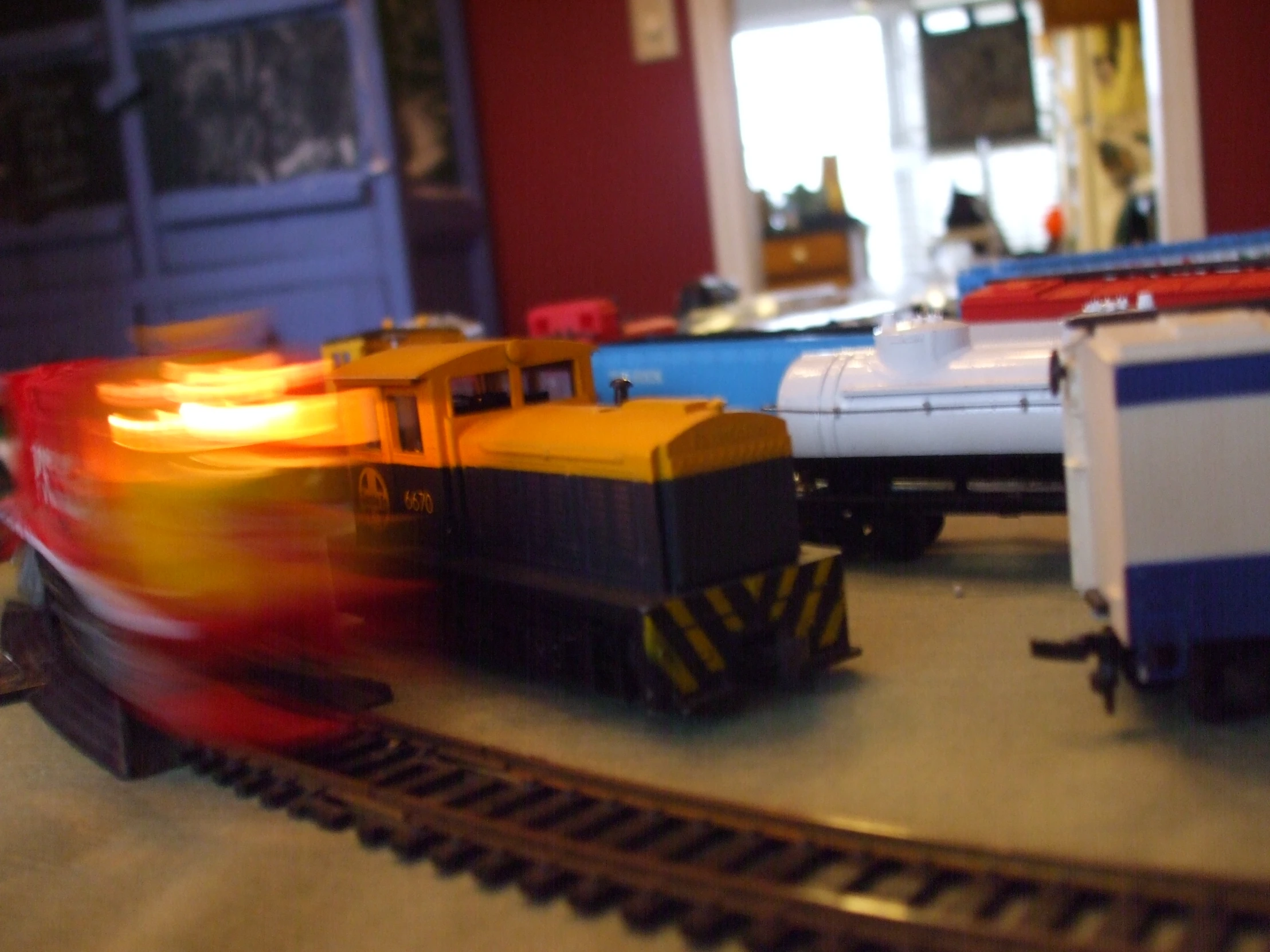 small toy trains on track during the day