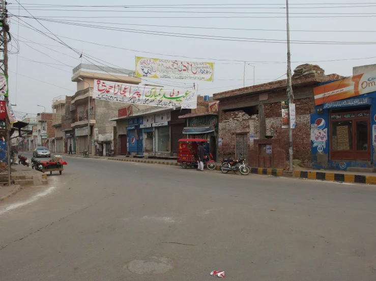 old buildings and signs on the sides of the road