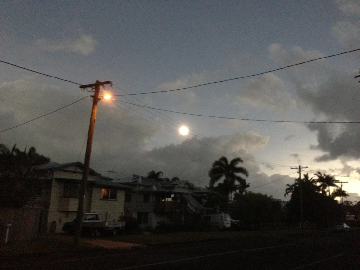 the night sky over a street at dusk