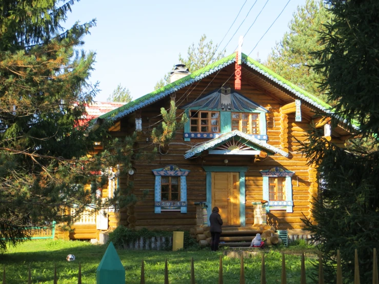 a person is standing in front of a house