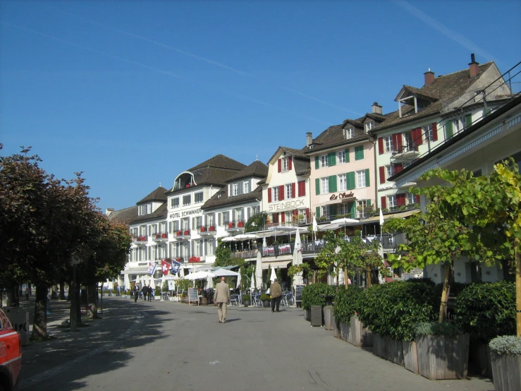 a row of houses on the corner of a street