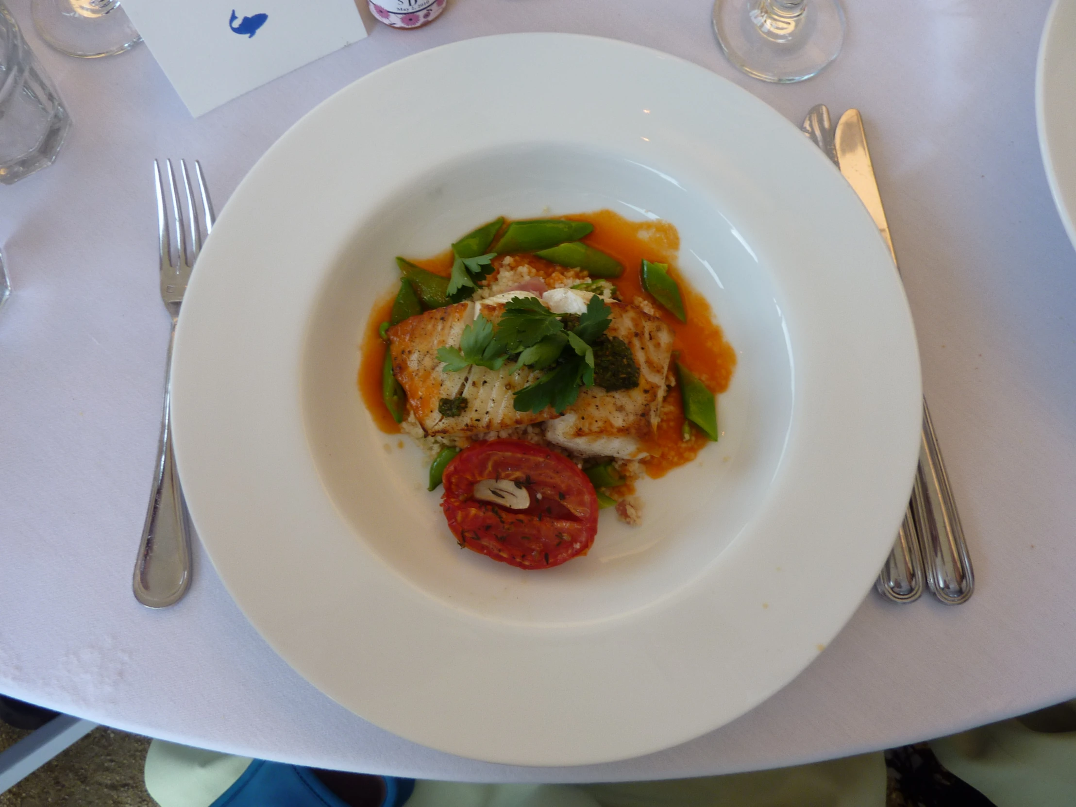 a white plate topped with food and veggies