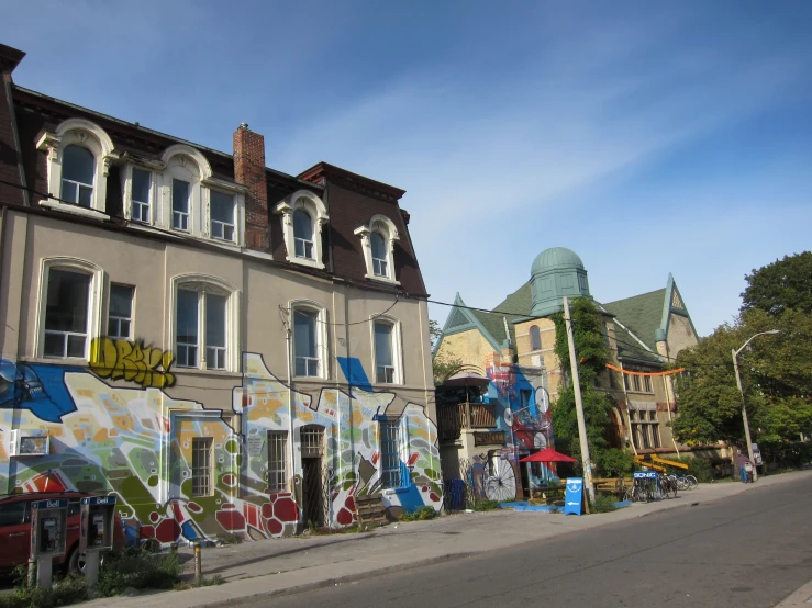 several buildings with graffiti on the side of them