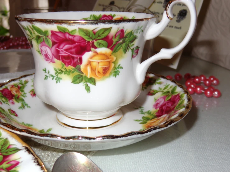 a tea cup and saucer on a table