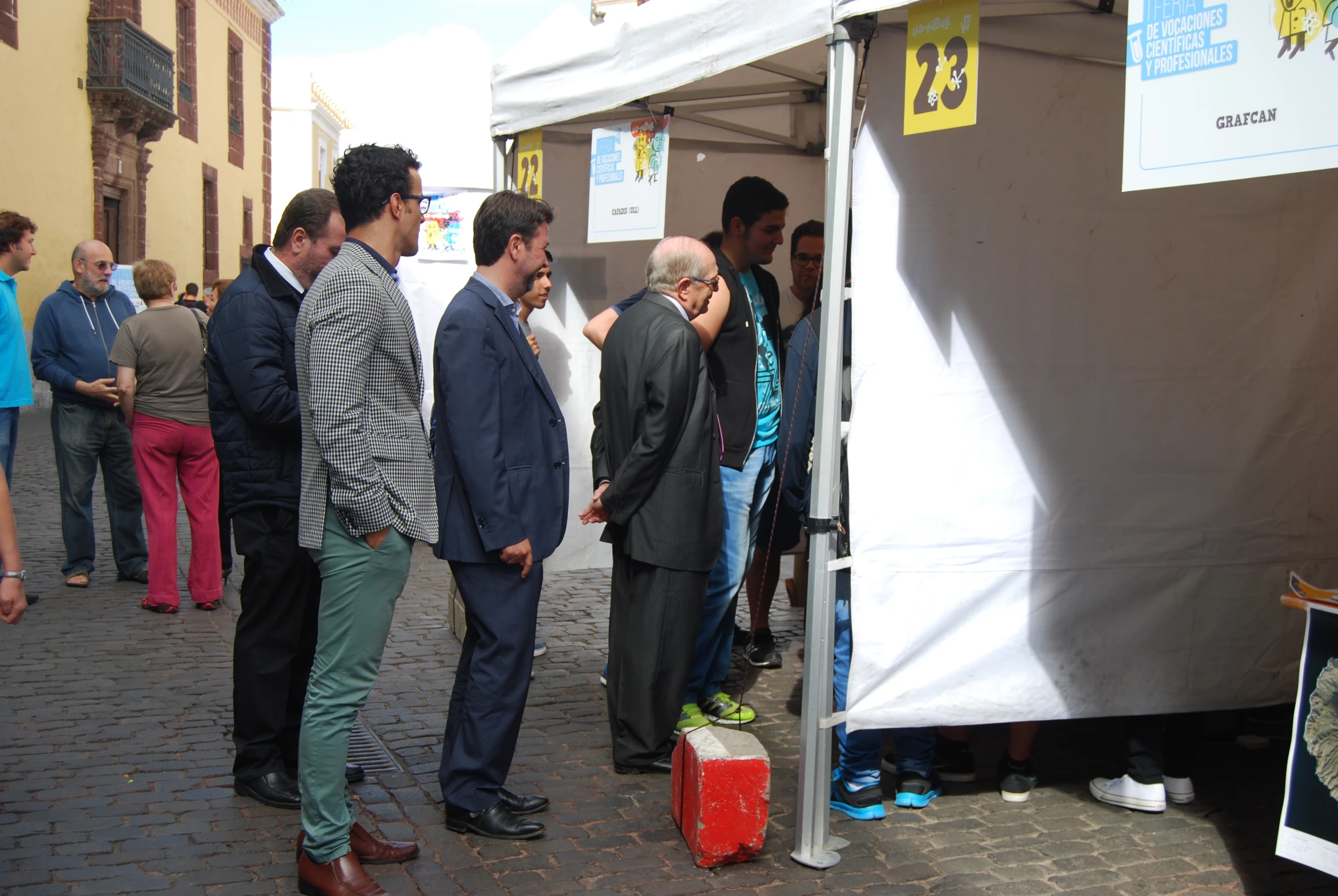 there is people gathered together near a tent