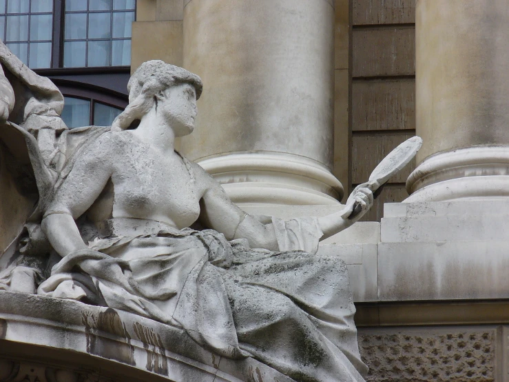 a sculpture is shown near many pillars and windows