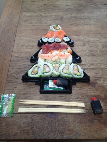 the sushi platter is being displayed for a picture