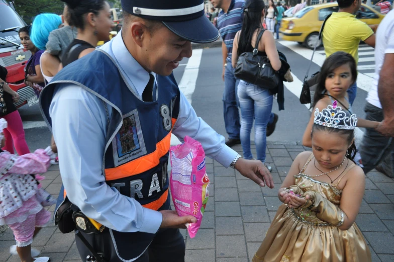 police officer offering candy to a 